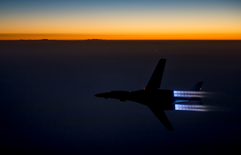 Illustration for article titled Refueling A Beat To Shit B-1 By Day And A Gorgeous F-22 By Night